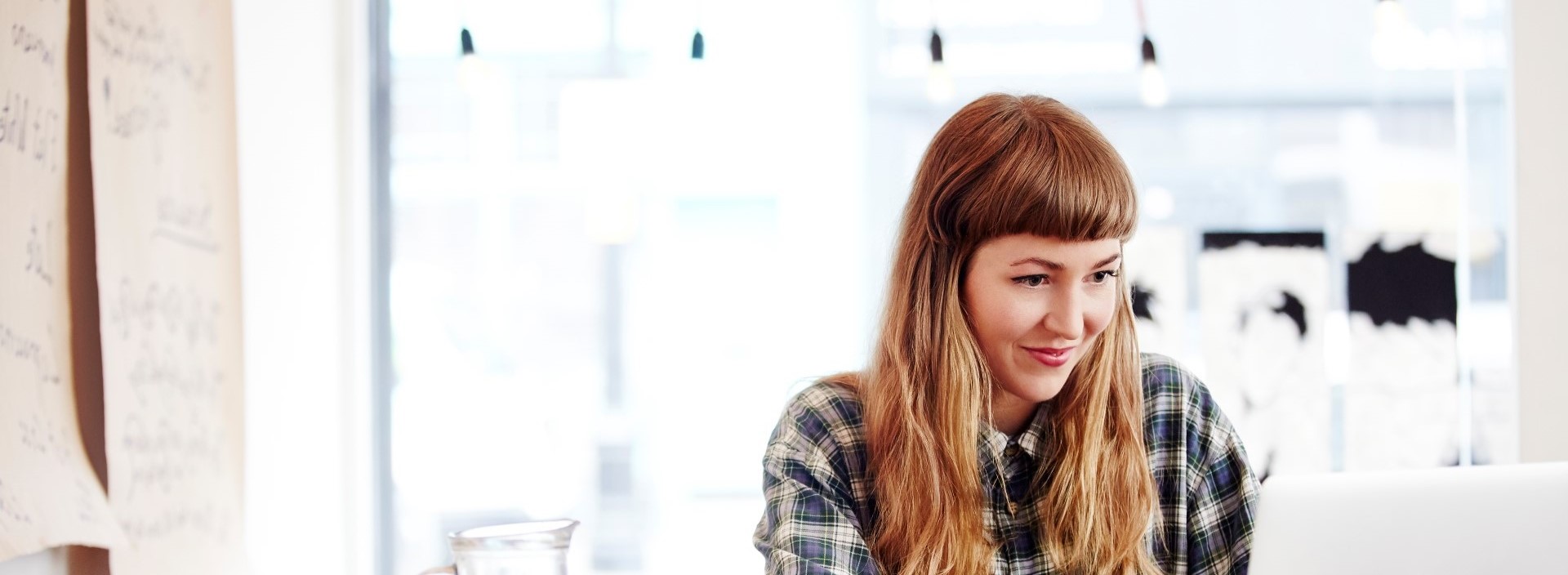 Woman smiling at laptop